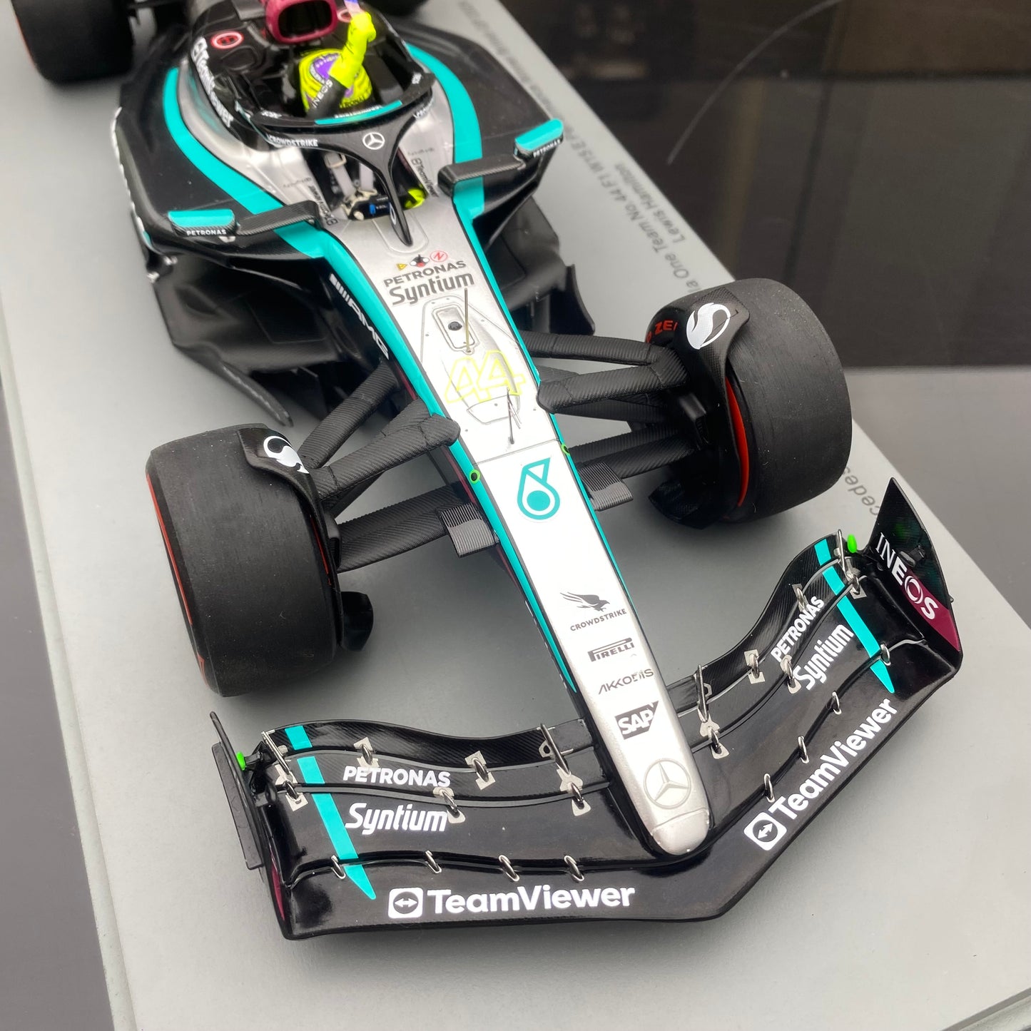 Spark 1/18 Mercedes-AMG W15 UK Grand Prix Victory No. 44 Hamilton Sitting and Holding the Flag Version